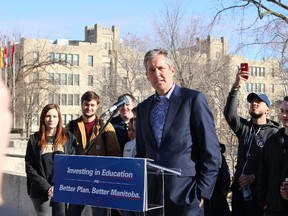 Progressive Conservative leader Brian Pallister hopes to double post-secondary scholarships and bursaries to $20 million, while enticing the private sector to donate two-thirds of that tab. Pallister made the campaign pledge March 28, 2016 at the University of Manitoba, surrounded by students. (JOYANNE PURSAGA/Winnipeg Sun/Postmedia Network)