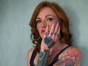 Tattoo artist Auberon Wolf stands for a photograph in Vancouver, B.C., on Tuesday March 22, 2016. People who have attempted suicide and been the victims of physical assault are finding a psychological healing by having their scars incorporated into tattoos. During busy weeks, Vancouver tattoo artist Auberon Wolf will collaborate with upwards of 10 clients on their designs. (THE CANADIAN PRESS/Darryl Dyck)