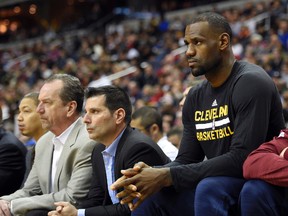 Cavaliers forward LeBron James (right) won't be in the lineup against the Rockets on Tuesday. (AP Photo/Nick Wass)