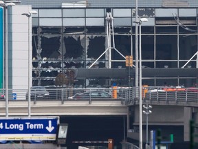 The blown out windows of Zaventem airport are seen after the recent  deadly terror attack in Brussels, Belgium. (AP PHOTO)