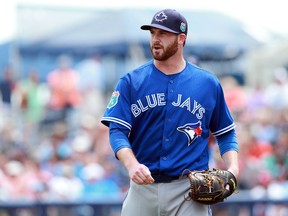 Toronto Blue Jays starting pitcher Drew Hutchison walks back to the dugout during the first inning against the Tampa Bay Rays at Charlotte Sports Park. (Kim Klement/USA TODAY Sports)