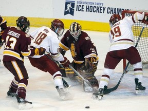 Minnesota-Duluth goalie Kasimir Kaskisuo makes a save during second-period NCAA action in Worcester, Mass., on March 26, 2016. (AP Photo/Michael Dwyer)