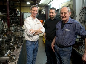 Jim Wilson, left, his son Trevor and dad Ray Wilson in the Wilson Transmission shop on Falcon Street. The business has operated nearly 40 years. (Mike Hensen/The London Free Press)
