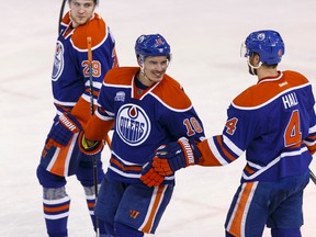 Edmonton's Nail Yakupov (10) celebrates his goal with Taylor Hall (4) and Leon Draisaitl (29) during the third period of an NHL game between the Edmonton Oilers and the Anaheim Ducks at Rexall Place in Edmonton on March 28, 2016.