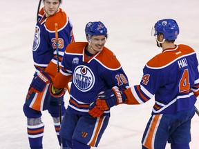 Edmonton's Nail Yakupov, middle, celebrates his goal with Taylor Hall, right, and Leon Draisaitl  during the third period of an NHL game between the Edmonton Oilers and the Anaheim Ducks at Rexall Place in Edmonton on March 28, 2016.
