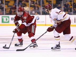 Jimmy Vesey of the Harvard Crimson skates against Steve Santini of the Boston College Eagles during second-period action at the Beanpot Tournament consolation game at TD Garden in Boston on Feb. 23, 2015. (Maddie Meyer/Getty Images/AFP)
