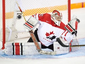 Team Canada's goaltender Emerance Maschmeyer makes a glove save during first period action against Team USA at the women's world hockey championships Monday, March 28, 2016 in Kamloops, B.C. THE CANADIAN PRESS/Ryan Remiorz