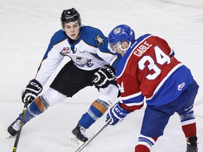 Edmonton's Kole Gable (right) and Kootenay's Dallas Hines battle during a WHL hockey game between the Edmonton Oil Kings and the Kootenay Ice at Rexall Place in Edmonton, Alta. on Monday October 26, 2015. - Ian Kucerak/Postmedia Network