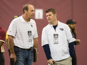 Tennessee Titans head coach Mike Mularkey, left, watches players workout with Jon Robinson during Florida State's NFL football pro day in Tallahassee, Fla., Tuesday, March 29, 2016. (AP Photo/Mark Wallheiser)