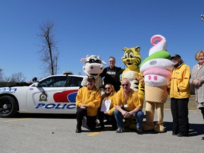 Emily Mountney-Lessard/The Intelligencer
Shaker the Cow, Friendly the Giant Tiger and Menchie show their support for the Pitter Patter Fun Run, coming up on April 17. Shown here with the mascots are Belleville Police Service Cst. Mark Hall, Community Policing volunteers Ann Carr, Barbara Lea, Tim Pekkonen, Erin Mc Adam and Don Carr.