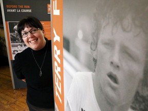 Luke Hendry/The Intelligencer
Glanmore National Historic Site intern Sara Hart stands among the display boards of the new temporary Terry Fox exhibit in the museum in Belleville Tuesday. The travelling exhibit details his Marathon of Hope for cancer research and quotes from his journals.