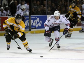 Kingston Frontenacs' Chad Duchesne and Oshawa Generals' Brock Welsh chase the puck in the neutral zone during the first period of Game 1 of an Ontario Hockey League Eastern Conference quarter-final series at the Rogers K-Rock Centre on March 25. (Steph Crosier/The Whig-Standard)