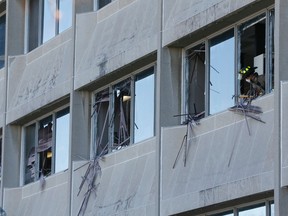 Toronto Fire remove dangerous pieces of glass after a vandal (or vandals) shattered windows at the Etobicoke Municipal offices on The West Mall Tuesday March 29, 2016. (Stan Behal/Toronto Sun)