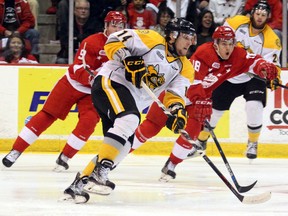 Sarnia Sting winger Pavel Zacha carries the puck with Soo Greyhounds centre Hayden Verbeek (38) and winger Zachary Senyshyn in hot pursuit during first-period action Tuesday, March 29, 2016 in Game 3 of the OHL Western Conference quarter-final at Essar Centre in Sault Ste. Marie, Ont. (JEFFREY OUGLER/SAULT STAR/POSTMEDIA NETWORK)