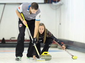 John Morris and Rachel Homan at a mixed doubles event. (The Canadian Press)
