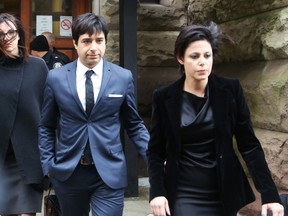 Former Canadian radio host Jian Ghomeshi leaves court with his attorney Marie Henein (R), after an Ontario judge found him not guilty on four sexual assault charges and one count of choking in Toronto, March 24, 2016.  REUTERS/Jenna Marie Wakani