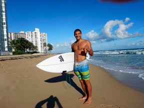 Joseph is one of the crowd of surfers on San Juan's Condado Beach who catches some waves in the morning before heading to work. STEVE MACNAULL/Special to Postmedia Network