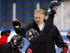 Team Canada head coach Melody Davidson gives high-fives to players at the end of practice at the Women's World Hockey Championship in Hameenlinna, Finland, on April 9, 2009. Davidson has coached the Canadian women to back-to-back Olympic gold medals in 2006 and 2010. She has the deepest resume of any woman in hockey, including scouting, coaching, managing and international mentorship of other coaches. (Jacques Boissinot/THE CANADIAN PRESS)
