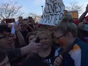A 15-year-old girl was pepper-sprayed as opponents and supporters of Donald Trump clashed outside a Wisconsin rally. (YouTube screengrab)