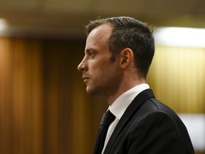 Oscar Pistorius stands in the dock at the North Gauteng High Court in Pretoria, South Africa for a bail hearing on Dec. 8, 2015. Pistorius will face sentencing in June following his conviction for murdering his girlfriend, according to a report. (Reuters/Herman Verwey/Pool)