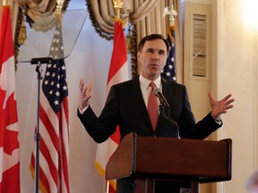 Finance minister Bill Morneau delivers his remarks as keynote speaker at a luncheon hosted by the Canadian Association of New York, at the Yale Club in New York, Wednesday, March 30, 2016. (AP Photo/Richard Drew)