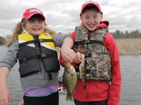 Siblings Norah, left, and Liam Collins experience their first day of targeting panfish on the Rideau River near Ottawa. (Supplied photo)