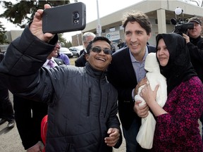 Prime Minister Justin Trudeau poses for photos with Edmontonians prior to visiting the Family Futures Resource Network, 3756 - 78 St., in Edmonton Alta. on Wednesday March 30, 2016. Photo by David Bloom