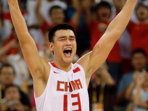 In this Aug. 16, 2008, file photo, China's Yao Ming of the NBA's Houston Rockets reacts at the end of  men's basketball game against Germany at the 2008 Olympics in Beijing. (AP Photo/Dusan Vranic, File)