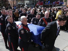The casket of Rob Ford Arrives at St. James  Cathedral  with the family looking on. (CRAIG ROBERTSON, Toronto Sun)