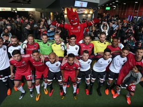 Ottawa FC gathered for a photo after being introduced to the fans during a press conference at TD Place in Ottawa on March 30, 2016. (Tony Caldwell/Postmedia)