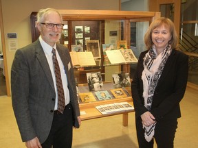 Alvan Bregman, left, and Kim Bell, with the W.D. Jordan Special Collections and Music Library on the Queen's University campus in Kingston, Ont. on Tuesday, March 29, 2016, stand in front of part of a display on prison newsletters. Michael Lea The Whig-Standard Postmedia Network