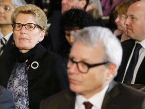Liberal MP Adam Vaughan (front) and Premier Kathleen Wynne (behind) attend Rob Ford's funeral on Wednesday. (REUTERS)