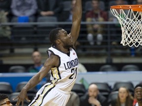 Stephen Maxwell, shown here soaring over Orangeville A's player Lewis Jackson in a recent game, led London Lightning to a win over Windsor in the final regular-season game of the year Saturday night. Maxwell had 24 points and 15 rebounds. The A's return to Budweiser Gardens Monday for the teams' first playoff game. (Derek Ruttan/London Free Press)