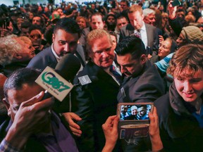 Doug Ford is mobbed by Ford Nation fans at Rob Ford's Celebration of Life party at the Toronto Congress Centre on Dixon Rd. (Dave Thomas/Toronto Sun/Postmedia Network)