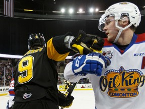 Edmonton's Dysin Mayo (right) and Brandon's Ivan Provorov tie up during the third period of a WHL playoff game between the Edmonton Oil Kings and the Brandon Wheat Kings in Edmonton, Alta., on Wednesday March 30, 2016.