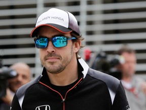 Fernando Alonso won't race at the Bahrain Grand Prix this weekend due to broken ribs and a lung injury suffered in a crash at the Australian Grand Prix on March 20. (Hasan Jamali/AP Photo)
