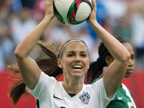 Five players from the World Cup-winning U.S. national team have accused the U.S. Soccer Federation of wage discrimination in an action filed with the Equal Employment Opportunity Commission. Alex Morgan (pictured), Carli Lloyd, Megan Rapinoe, Becky Sauerbrunn and Hope Solo maintain in the filing they were payed nearly four times less than their male counterparts on the U.S. men's national team. (Jonathan Hayward/The Canadian Press/Files)