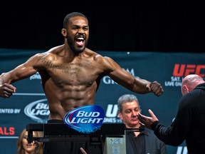 Jon Jones poses for fans during the weigh-ins for UFC 182 in Las Vegas on Jan. 2, 2015. (AP Photo/LE Baskow/The Las Vegas Sun/Files)