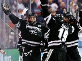 Brandon Tanev (left) celebrates his goal for the Providence College Friars April 11, 2015, against the Boston University Terriers.