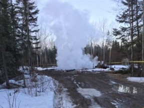 Police tape marks off a smouldering house on the Pikangikum First Nation, Wednesday, March 30, 2016. Nine people are believed to have died in a house fire on Pikangikum First Nation, says the member of Parliament for the riding that includes the northwestern Ontario community. THE CANADIAN PRESS/HO-Kyle Peters