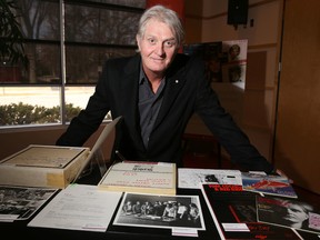 Musician Tom Cochrane with some of EMI Music Canada’s archives donated to the University of Calgary. Leah Hennel/Postmedia