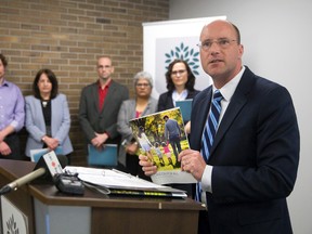 Mayor Matt Brown discusses recommendations made by his advisory panel on poverty, as panel members Dr. Chris Mackie, left, Helene Berman, Abe Oudshoorn, Dharshi Lacey and Maureen Cassidy listen on at a city hall press conference in London, Ont. on Thursday March 31, 2016.  Craig Glover/The London Free Press/Postmedia Network