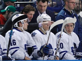 Toronto Maple Leafs head coach Mike Babcock talks to right winger Tobias Lindberg from behind the bench during first-period NHL action against the Buffalo Sabres at First Niagara Center in Buffalo on March 31, 2016. (Kevin Hoffman/USA TODAY Sports)
