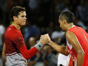 Nick Kyrgios (right) shakes hands with Milos Raonic after winning their quarterfinal Thursday at the Miami Open. Kyrgios won 6-4, 7-6(4). (Geoff Burke/USA TODAY Sports)