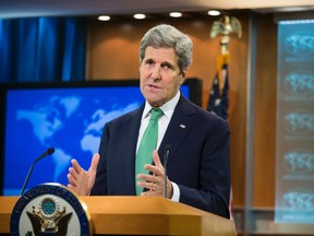 Secretary of State John Kerry speaks to reporters at the State Department in Washington, Thursday, March 17, 2016.   Kerry has determined that the Islamic State group is committing genocide against Christians and other minorities in Iraq and Syria, as he acted to meet a congressional deadline.  (AP Photo/J. Scott Applewhite)
