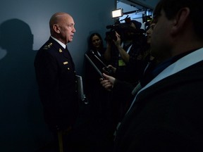 RCMP Commissioner Bob Paulson speaks to media after delivering a speech at a security conference in Ottawa on Nov. 25, 2015. Paulson was reluctant to answer questions about a speeding ticket he avoided after being stopped by an officer along a British Columbia highway. (THE CANADIAN PRESS/Sean Kilpatrick)