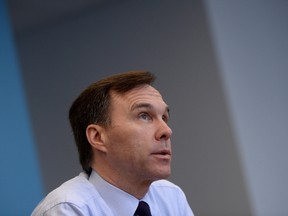 Finance Minister Bill Morneau takes part in an interview at Finance Headquaters in Ottawa on Thursday, March 24, 2016. Morneau is defending the Liberal government's decision to boost employment insurance benefits for parts of Alberta and Saskatchewan while leaving some hard hit areas of the oil patch out of the budget plan. THE CANADIAN PRESS/Sean Kilpatrick