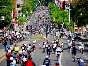 This undated image provided by Velo Quebec shows bicyclists touring Montreal as part of a bike festival that typically brings out 15,000 people for a night ride and 25,000 for the main event a few days later. This year’s Tour la Nuit is June 3 and the Tour de l’lle rolls Sunday, June 5. (Gaetan Fontaine/ Velo Quebec, via AP)