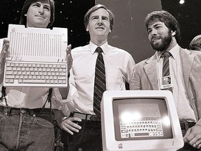 In this April 24, 1984, file photo, Steve Jobs, left, chairman of Apple Computers, John Sculley, centre, president and CEO, and Steve Wozniak, co-founder of Apple, unveil the new Apple IIc computer in San Francisco. (AP Photo/Sal Veder, File)