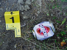 This evidence photo from the Travis Vader trial shows a beer can found at the scene of a bunted out motor home belonging to Lyle and Marie McCann.Greg Southam